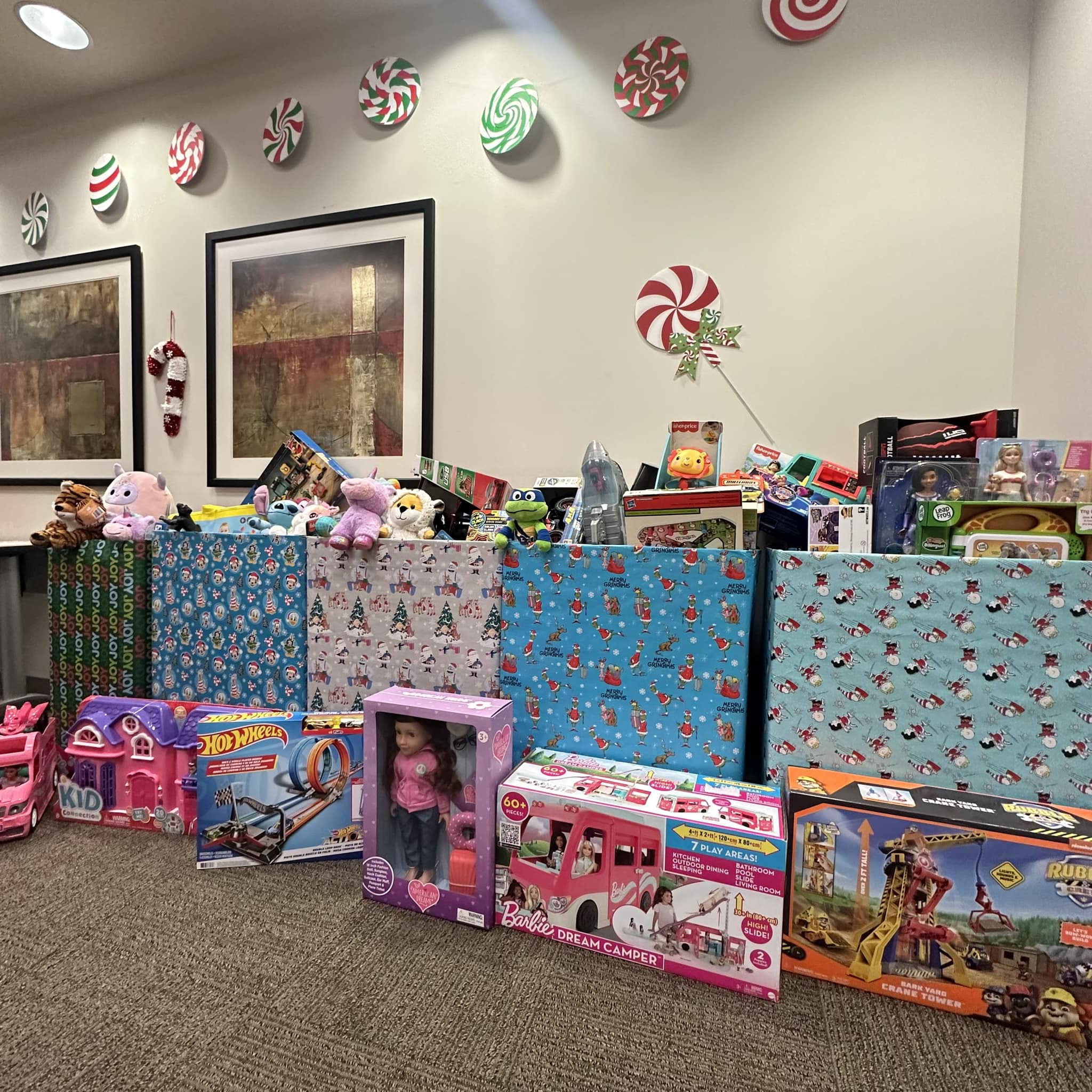 Boxes of donated toys lined up inside the Transportation Services office.