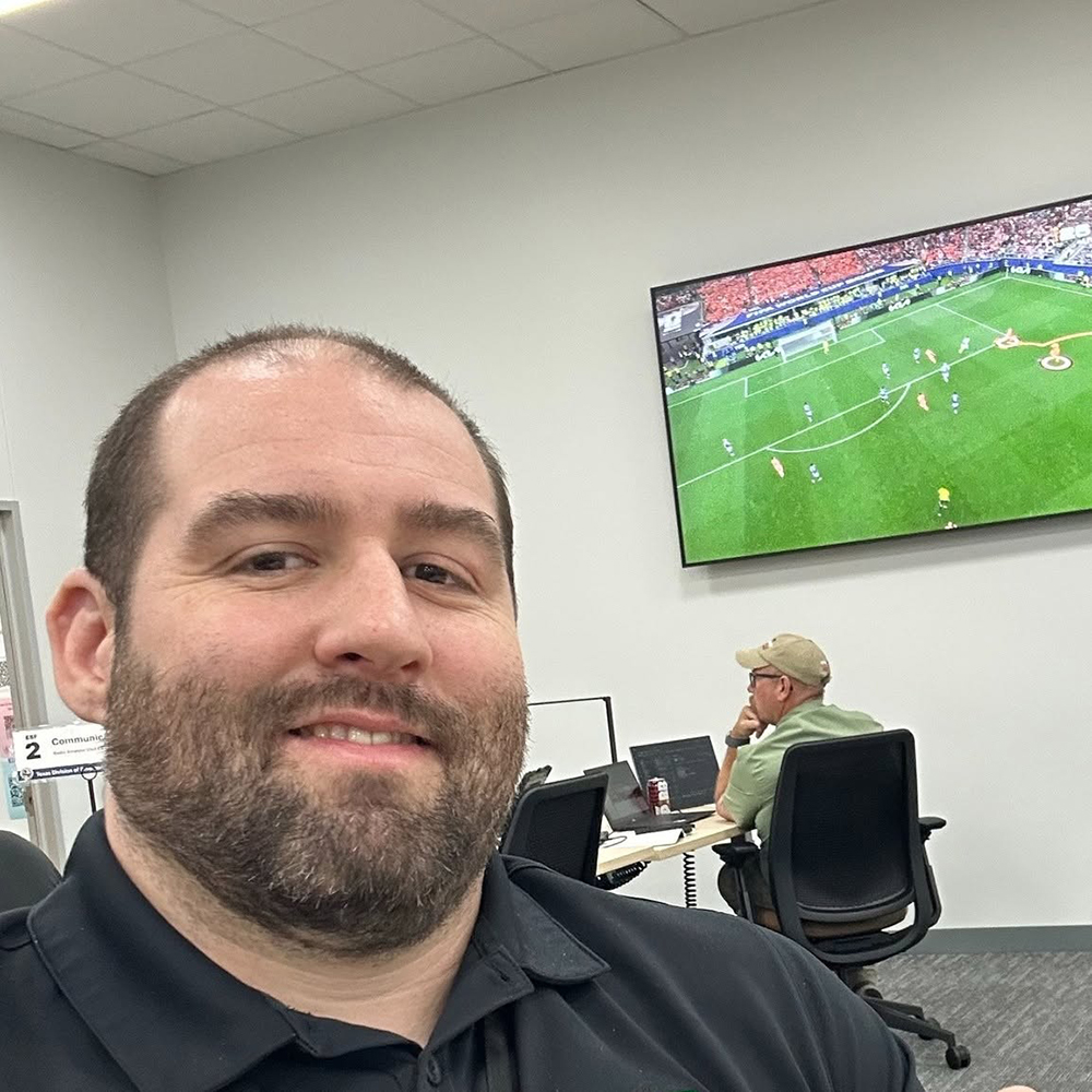 Associate Director Corey Olszewski took a selfie while keeping tabs on the World Cup games.